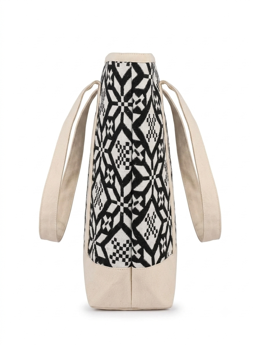 Black & White Geometric Printed tapestry and canvas women tote bag with a cream-coloured canvas base.