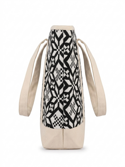 Black & White Geometric Printed tapestry and canvas women tote bag with a cream-coloured canvas base.