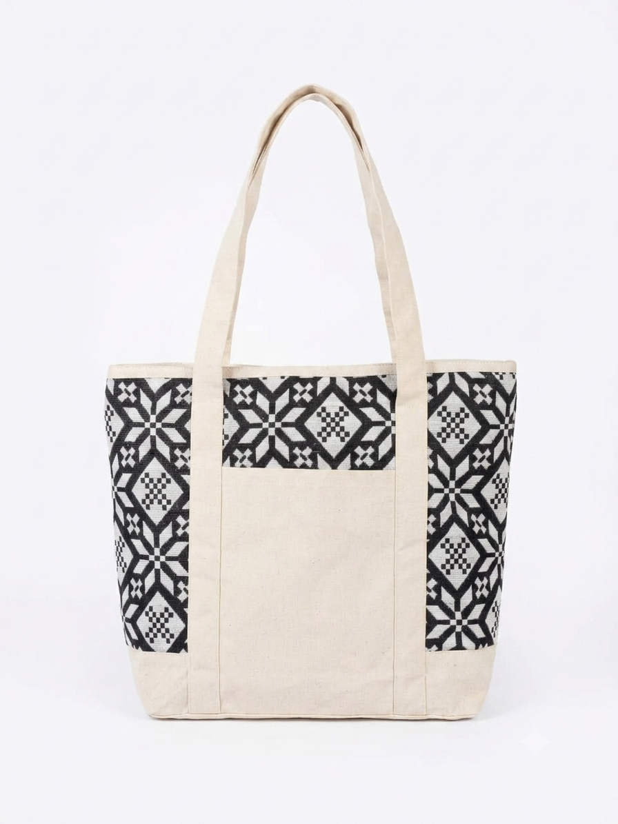 Black & White Geometric Printed tapestry and canvas women tote bag with a cream-coloured canvas base.